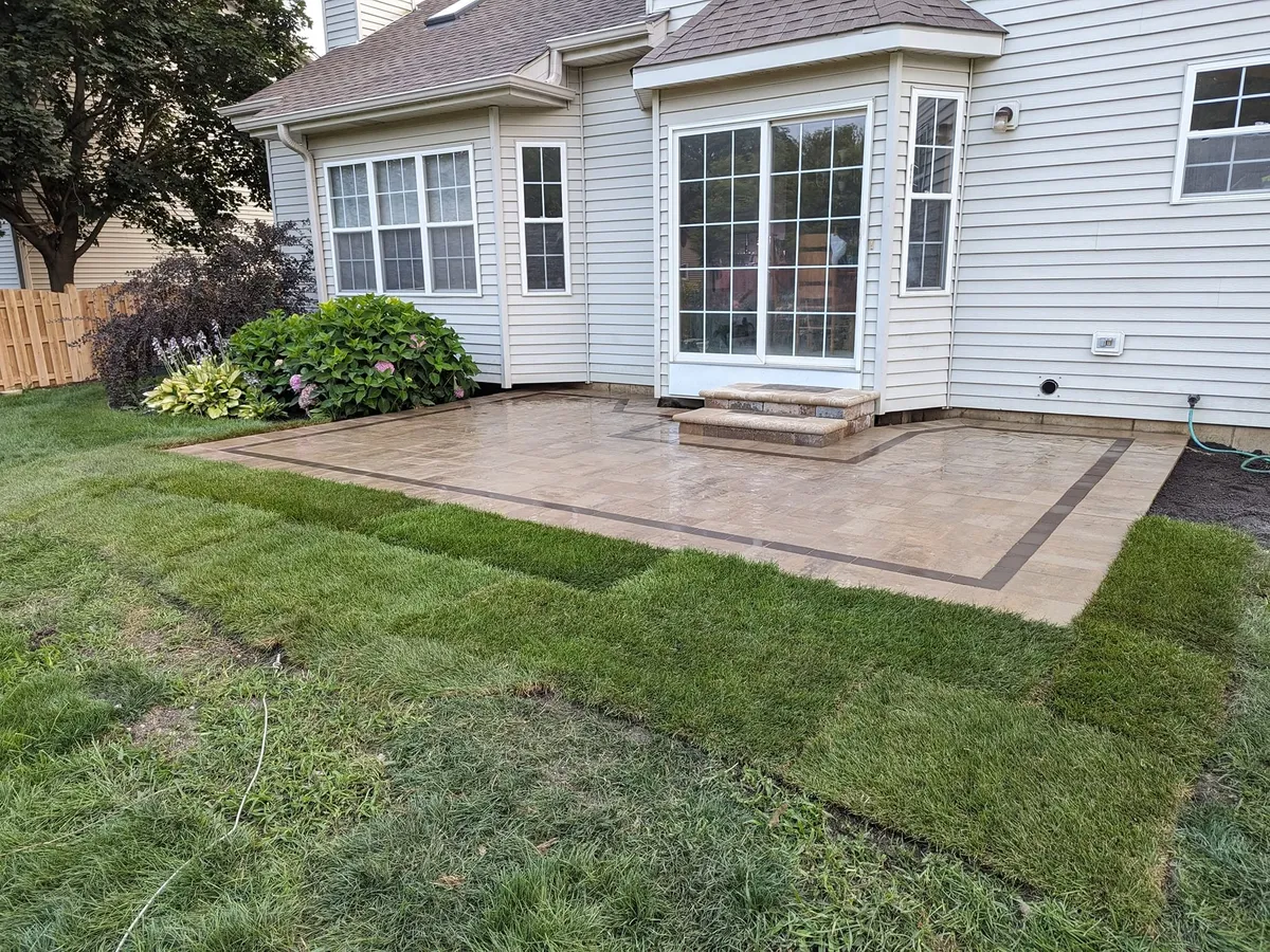 Finished paver patio in a residential backyard